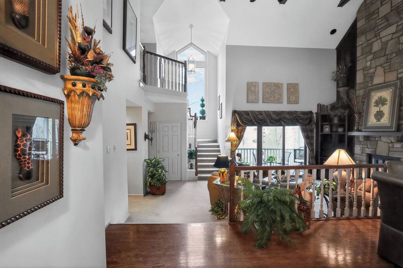 Entry hall looking up to the loft and staircase